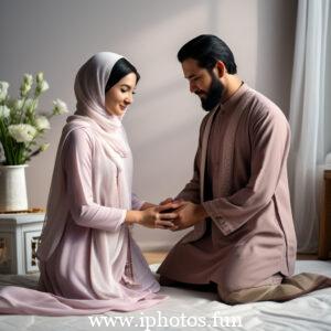 A Muslim couple sitting on a rug in front of a window, engaged in conversation and enjoying