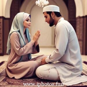 A man and woman in traditional Muslim attire praying in a mosque