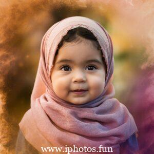 A captivating cinematic photo of a young girl with expressive eyes, wearing a vibrant pink hijab that gracefully drapes around her neck. She is attired in a delicate, light-colored outfit adorned with small golden embellishments, reflecting her elegance and grace. The background, a blurred outdoor setting with tall trees and a winding pathway, adds depth and serenity to the captivating scene